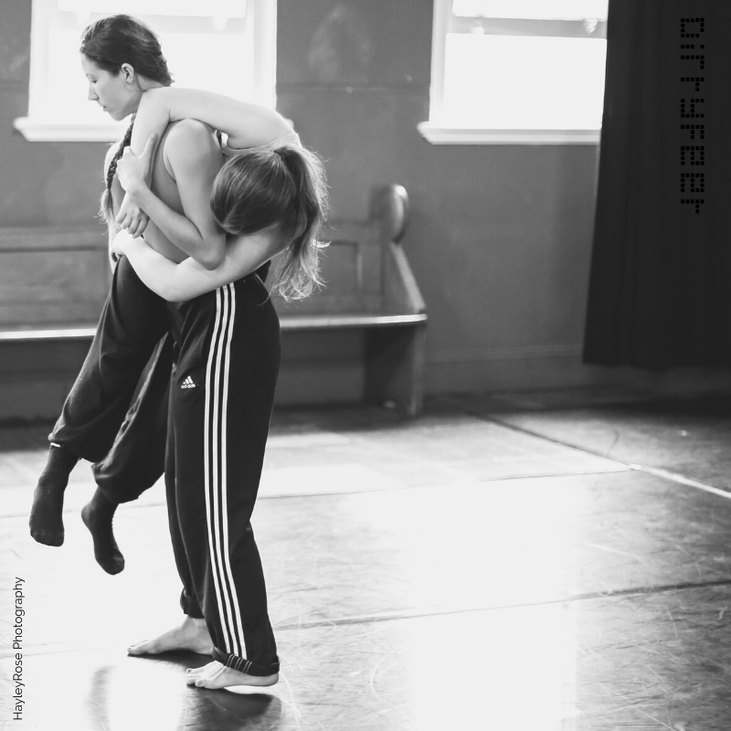 two dancers embracing 