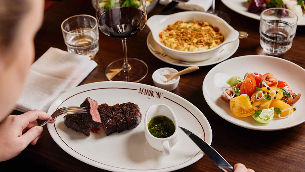Wagyu steak served with chimichurri, salad and sides.